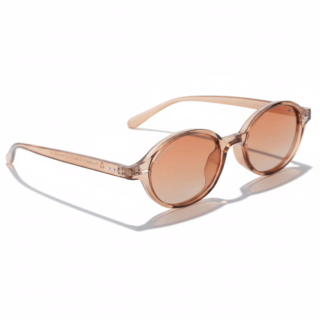 vista angulada de 45º de lentes de sol ovalados color champagne con lentes degradé cafe. Lentes ovalados retro de moda para hombre y mujer #color_champagne