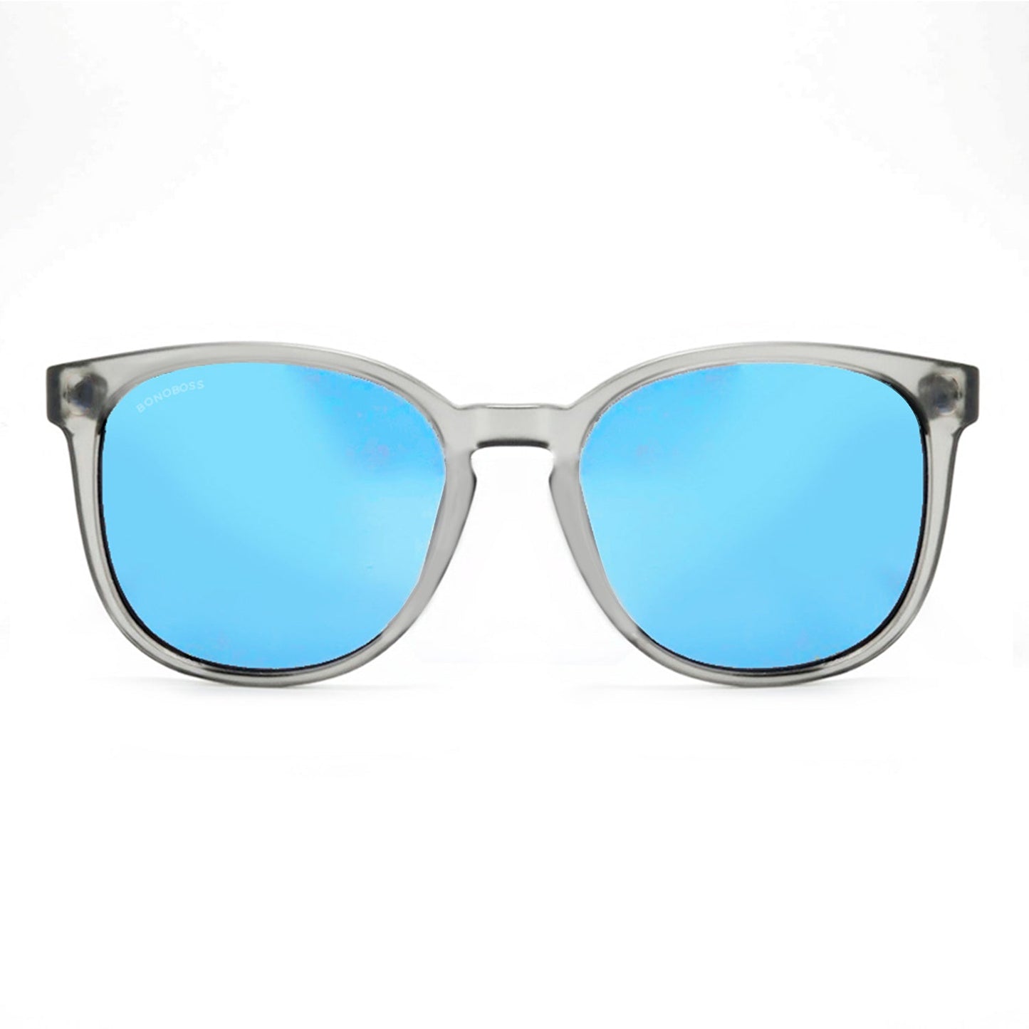 anteojos redondos de plástico reciclado y varillas de madera natural sustentable con lentes de color espejado azul. Polarizadas y forma redonda. La gafa es color transparente #color_espejado-azul