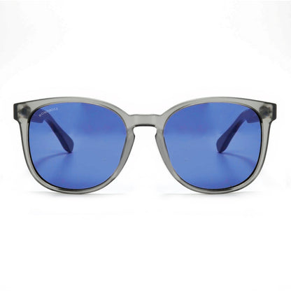 anteojos redondos de plástico reciclado y varillas de madera natural sustentable con lentes de color rosado. Polarizadas y forma redonda. La gafa es color transparente #color_degrade-azul