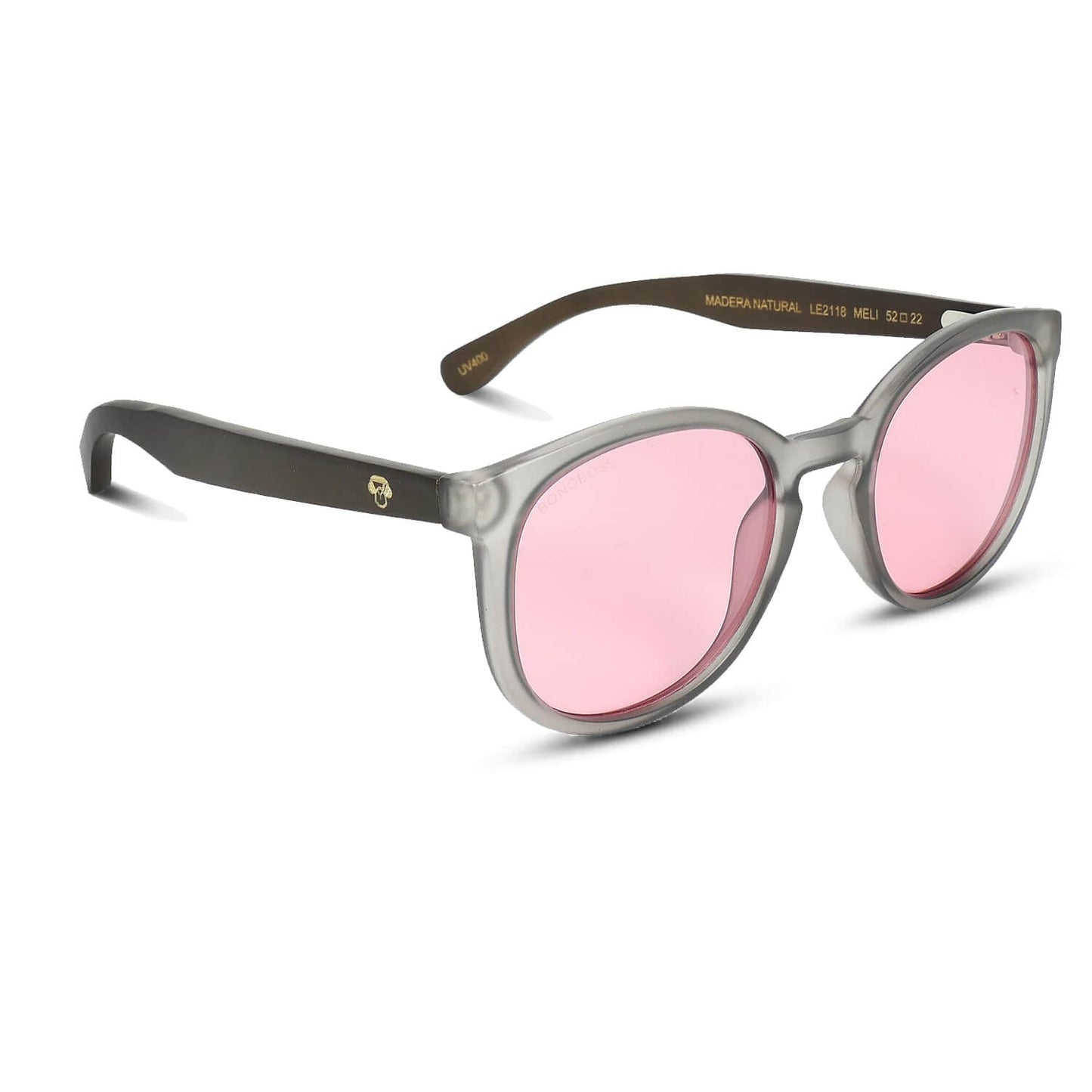 anteojos redondos de plástico reciclado y varillas de madera natural sustentable con lentes de color rosado. Polarizadas y forma redonda. La gafa es color transparente #color_rosado