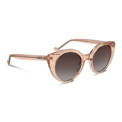 vista lateral de unos anteojos de sol gafas polarizadas de forma agatada retro para mujer de cara redonda grande   de color champagne rosado #color_champagne