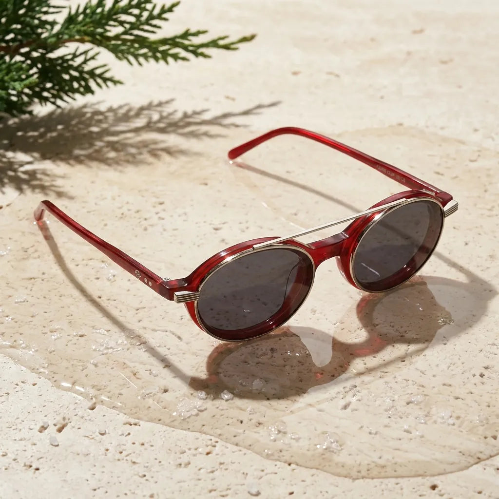 Bonoboss Capri Clip Sol Rojo - bio-acetato sobre travertino natural con agua #editorial_sustentabilidad #color_rojo