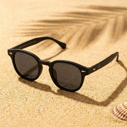 Lentes sol Waimea RPET polarizados UV400 sobre arena dorada costa textura natural Bonoboss #color_negro