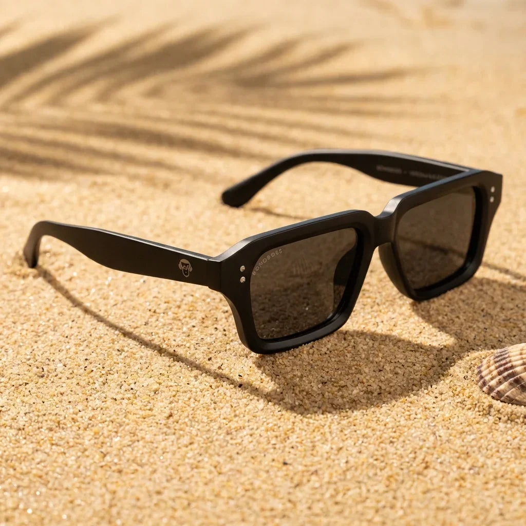 Lentes sol Verona polarizados UV400 sobre arena dorada costa textura natural Bonoboss #color_dark