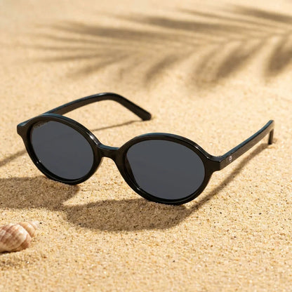 Lentes sol Guapi Island polarizados UV400 sobre arena dorada costa textura natural Bonoboss #color_negro