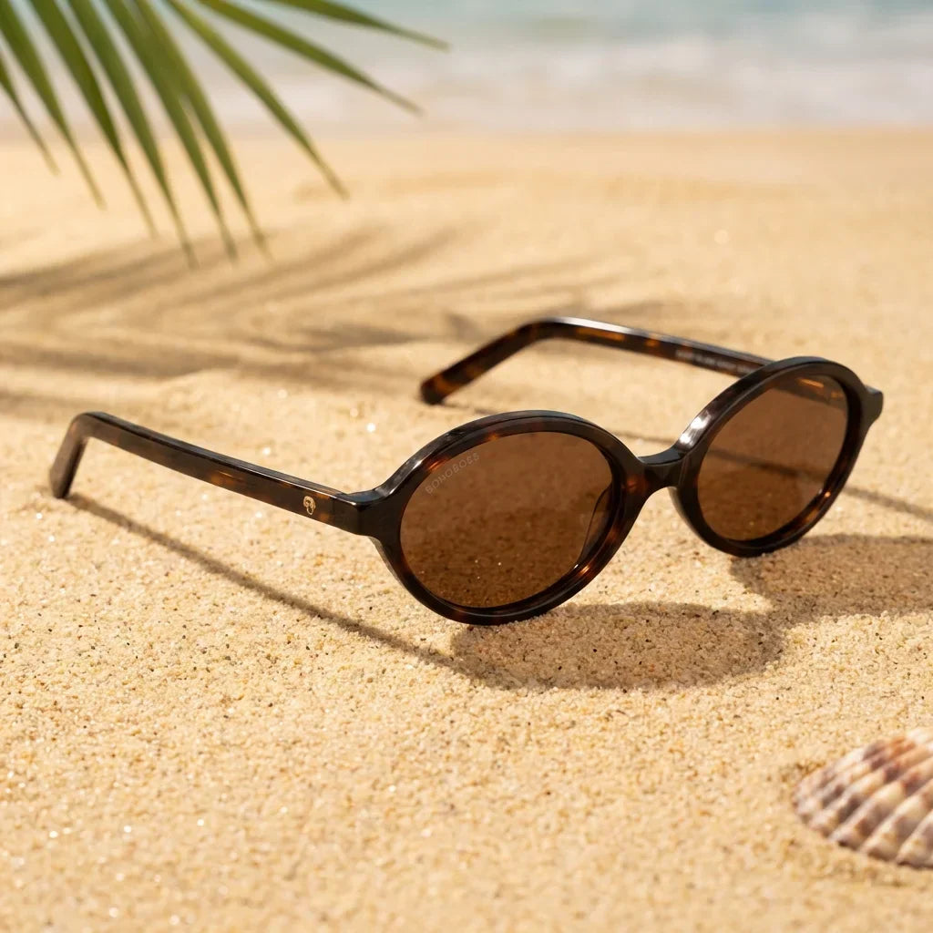 Lentes sol Guapi Island polarizados UV400 sobre arena dorada costa textura natural Bonoboss #color_carey