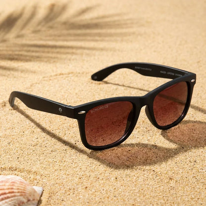 Lentes sol Acacio RPET polarizados UV400 sobre arena dorada costa textura natural Bonoboss #color_rojo