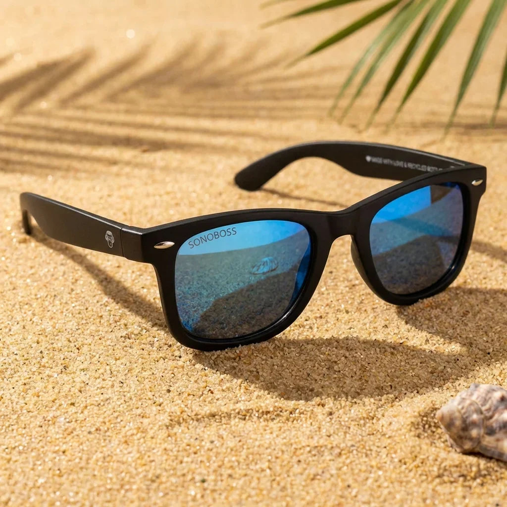 Lentes sol Acacio RPET polarizados UV400 sobre arena dorada costa textura natural Bonoboss #color_sky