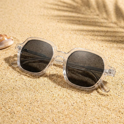 Lentes sol Canarias polarizados UV400 sobre arena dorada costa textura natural Bonoboss #color_transparente