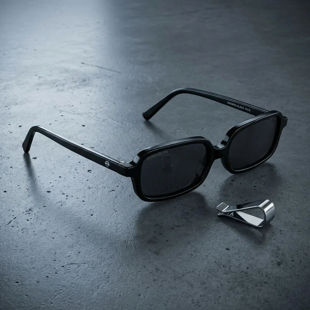 Lentes sol Navarino polarizados UV400 sobre concreto urbano textura industrial Bonoboss #color_negro