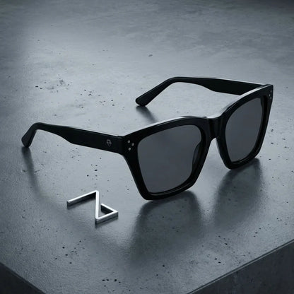 Lentes sol Bruna polarizados UV400 sobre concreto urbano textura industrial Bonoboss #color_negro