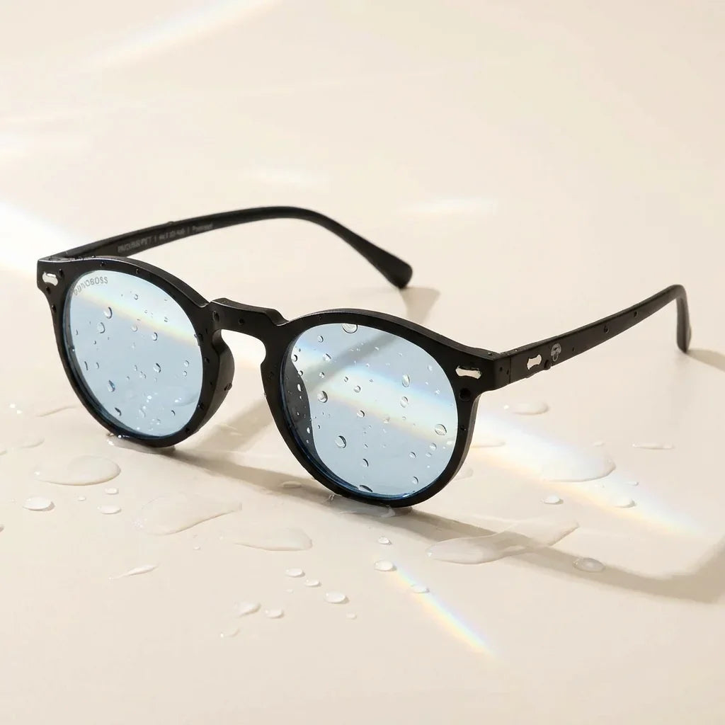 Lentes sol Temuco RPET polarizados UV400 sobre superficie con agua y luz natural Bonoboss #color_negro