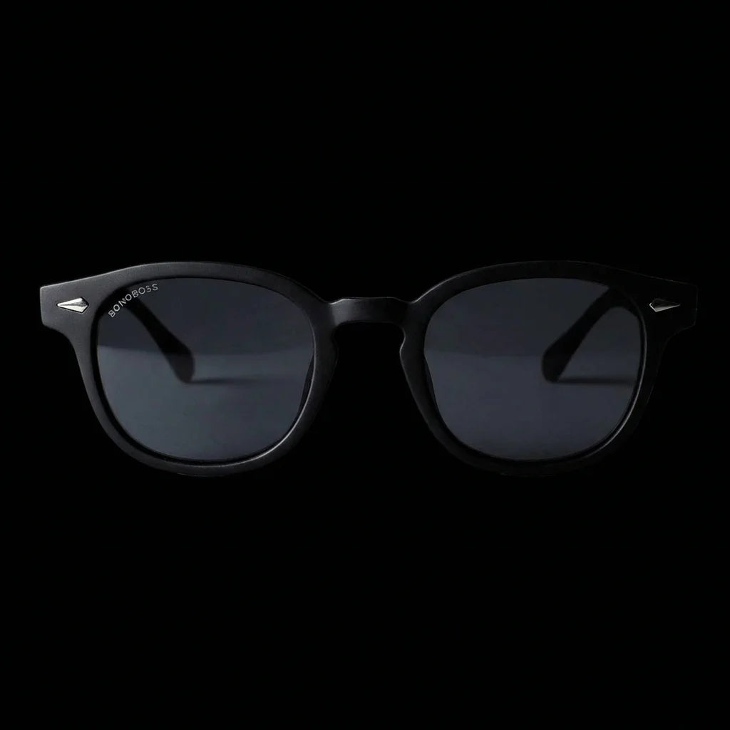 Lentes sol Waimea RPET polarizados UV400 frontal dramatico luz editorial Bonoboss #color_negro