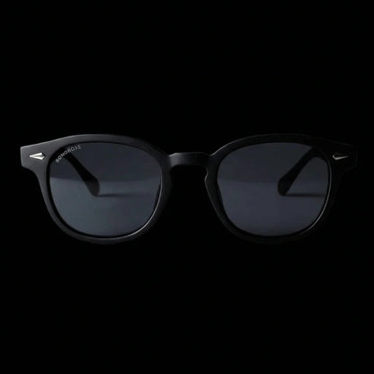 Lentes sol Waimea RPET polarizados UV400 frontal dramatico luz editorial Bonoboss #color_negro