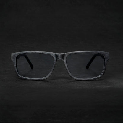 vista frontal de armazones o marcos opticos de material sustentable reciclado ecologico de forma rectangular de color negro para hombre y mujer de cara redonda#color_black