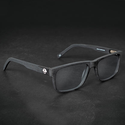 vista frontal de armazones o marcos opticos de material sustentable reciclado ecologico de forma rectangular de color negro para hombre y mujer de cara redonda#color_black