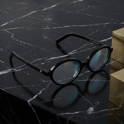 Lentes opticos Guapi Island Negro sobre marmol negro elegante antirreflex receta optica bio-acetato Bonoboss #editorial_marmol-negro #color_negro