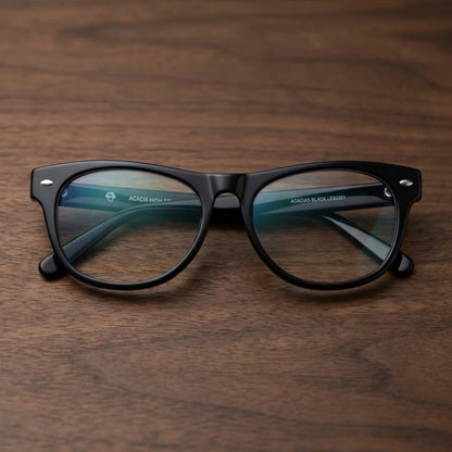 Lentes ópticos Acacia Negro sobre escritorio de madera premium calidad premium receta Bonoboss #editorial_banner_confianza #color_negro