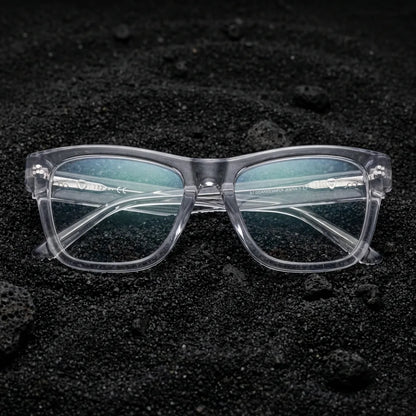 Lentes ópticos Barcelona 1 Transparente sobre arena volcánica texturizada diseño sustentable Bonoboss #editorial_sustentabilidad #color_transparente