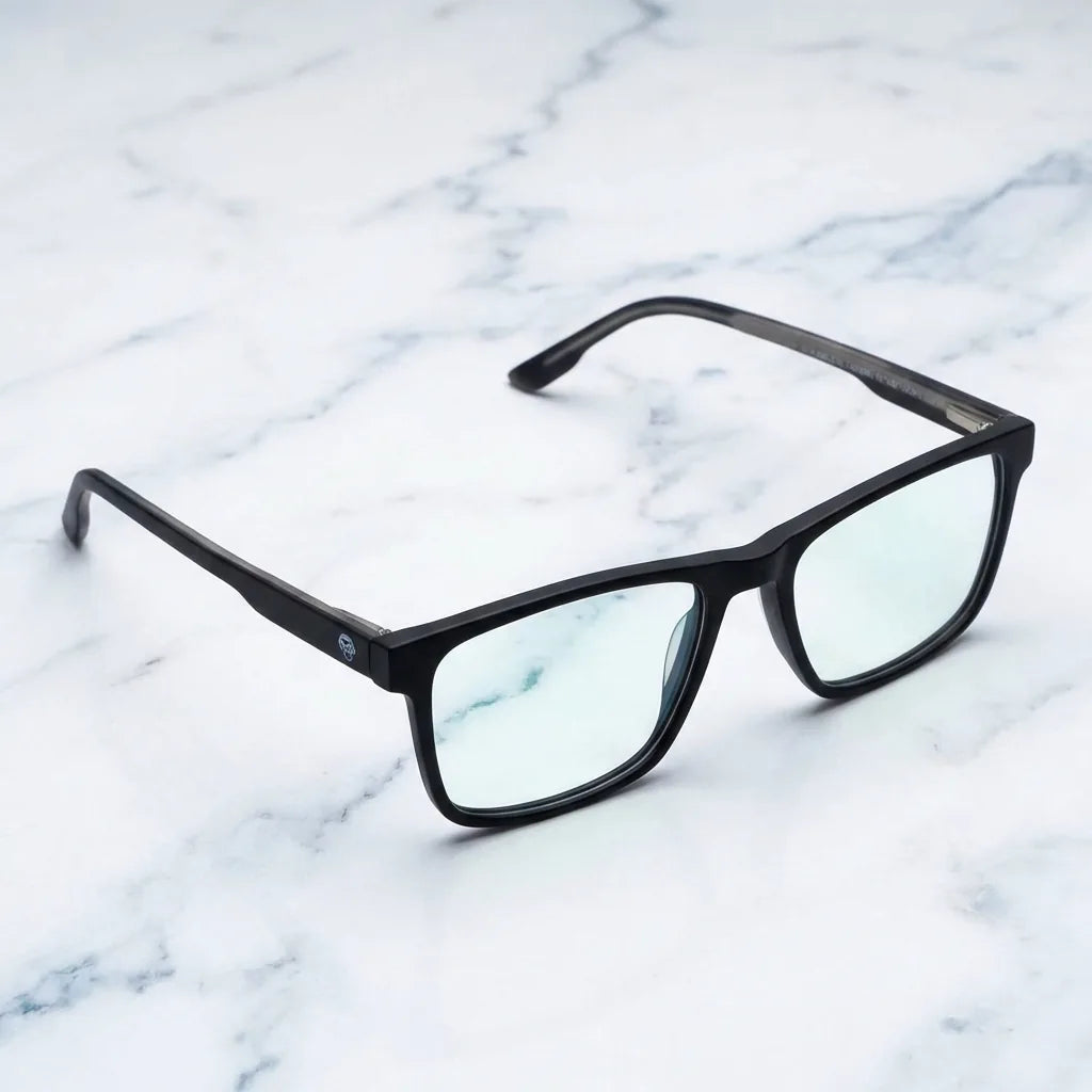 Lentes ópticos Canelo Negro sobre mármol blanco elegante armazón premium Bonoboss #editorial_armazon #color_negro