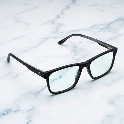 Lentes ópticos Canelo Negro sobre mármol blanco elegante armazón premium Bonoboss #editorial_armazon #color_negro