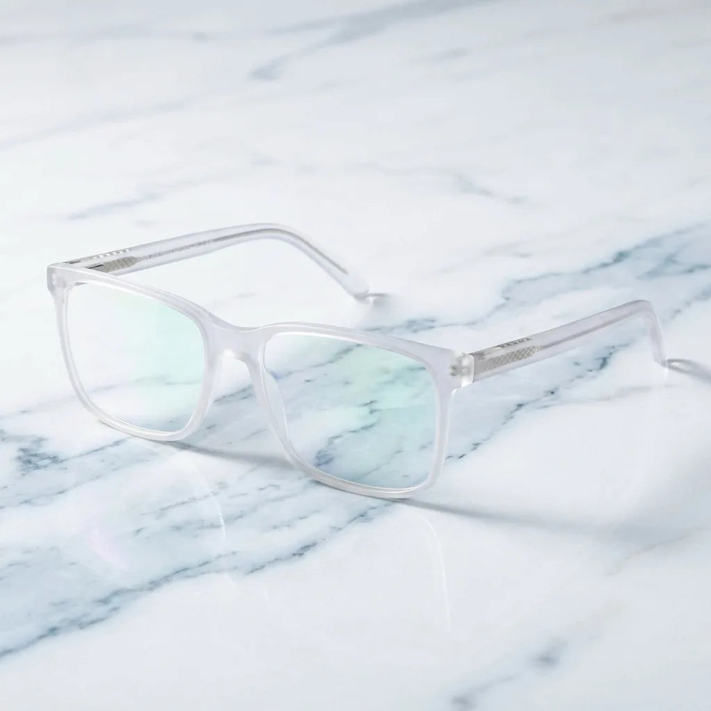 Lentes ópticos Don Eduardo Transparente sobre mármol blanco elegante armazón premium Bonoboss #editorial_armazon #color_transparente