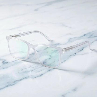 Lentes ópticos Don Eduardo Transparente sobre mármol blanco elegante armazón premium Bonoboss #editorial_armazon #color_transparente