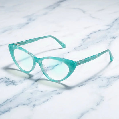 Lentes ópticos Hamburgo Calipso sobre mármol blanco elegante armazón premium Bonoboss #editorial_armazon #color_calipso