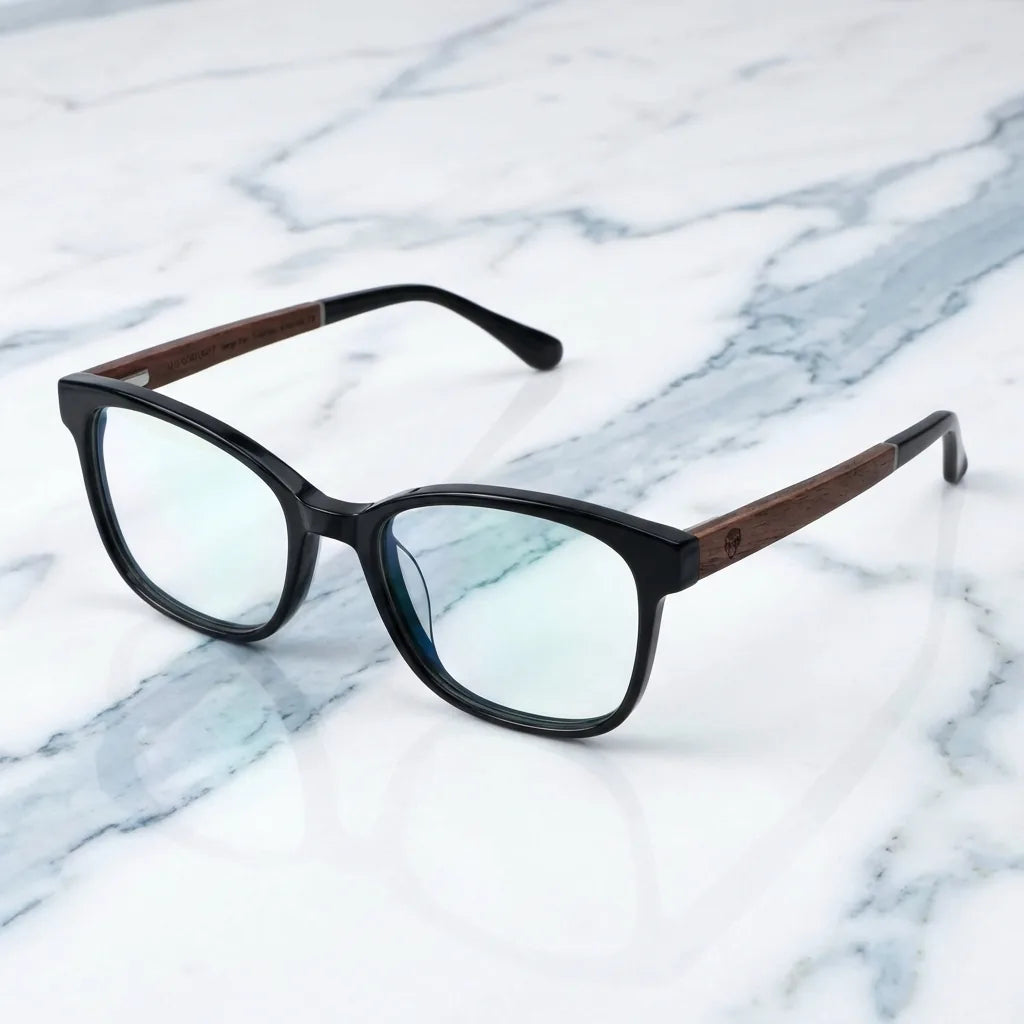 Lentes ópticos Hanga Roa Negro sobre mármol blanco elegante armazón premium Bonoboss #editorial_armazon #color_negro