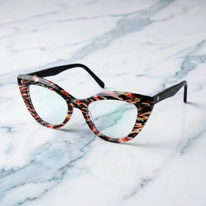 Lentes ópticos Helsinki Mosaico sobre mármol blanco elegante armazón premium Bonoboss #editorial_armazon #color_mosaico