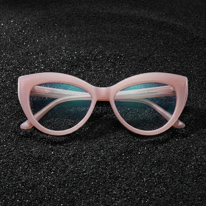 Lentes ópticos Montgat Rosado sobre arena volcánica texturizada diseño sustentable Bonoboss #editorial_sustentabilidad #color_rosado