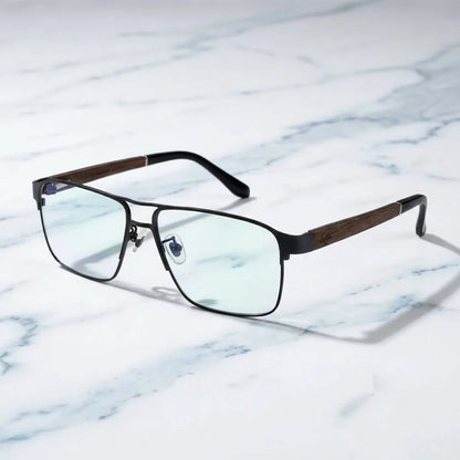 Lentes ópticos Neruda Negro sobre mármol blanco elegante armazón premium Bonoboss #editorial_armazon #color_negro