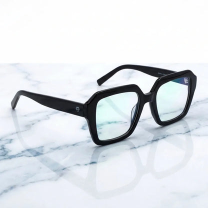 Lentes ópticos Rapel Negro sobre mármol blanco elegante armazón premium Bonoboss #editorial_armazon #color_negro