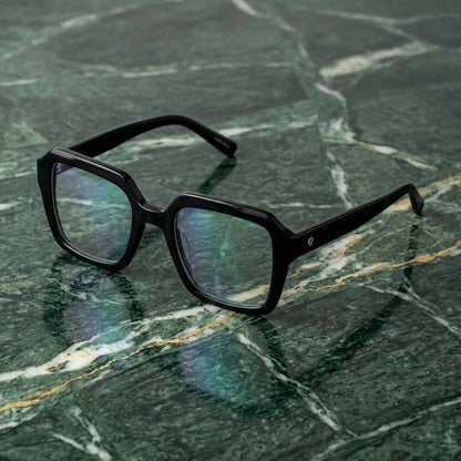 Lentes ópticos Rapel Negro sobre mármol verde natural diseño sustentable Bonoboss #editorial_sustentabilidad #color_negro