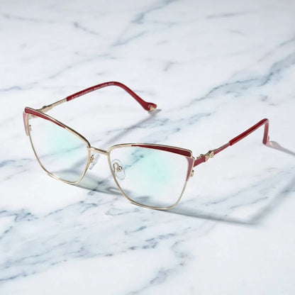 Lentes ópticos Sabrina Rojo sobre mármol blanco elegante armazón premium Bonoboss #editorial_armazon #color_rojo