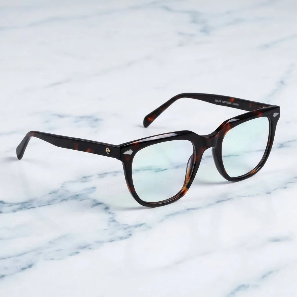 Lentes ópticos Selkie Carey sobre mármol blanco elegante armazón premium Bonoboss #editorial_armazon #color_carey