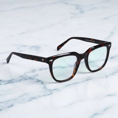 Lentes ópticos Selkie Carey sobre mármol blanco elegante armazón premium Bonoboss #editorial_armazon #color_carey