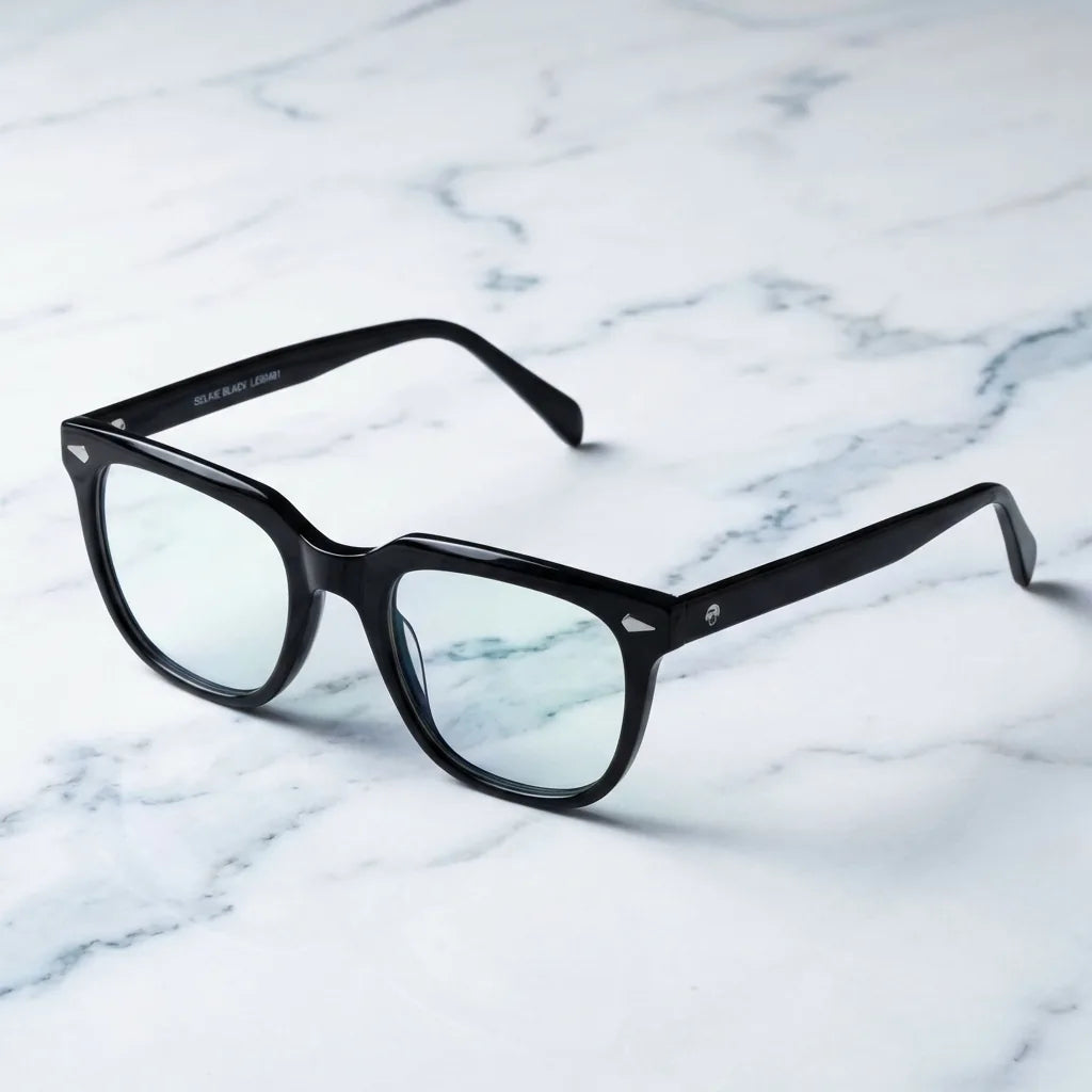 Lentes ópticos Selkie Negro sobre mármol blanco elegante armazón premium Bonoboss #editorial_armazon #color_negro