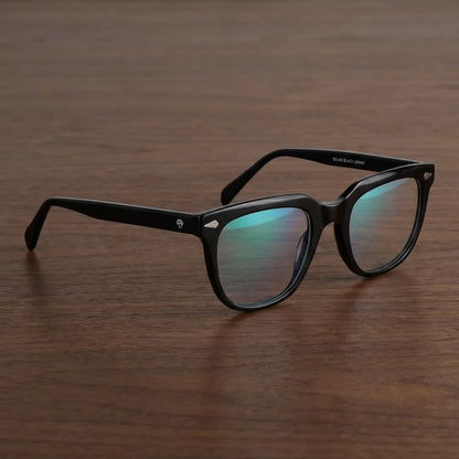Lentes ópticos Selkie Negro sobre escritorio de madera premium calidad premium receta Bonoboss #editorial_banner_confianza #color_negro
