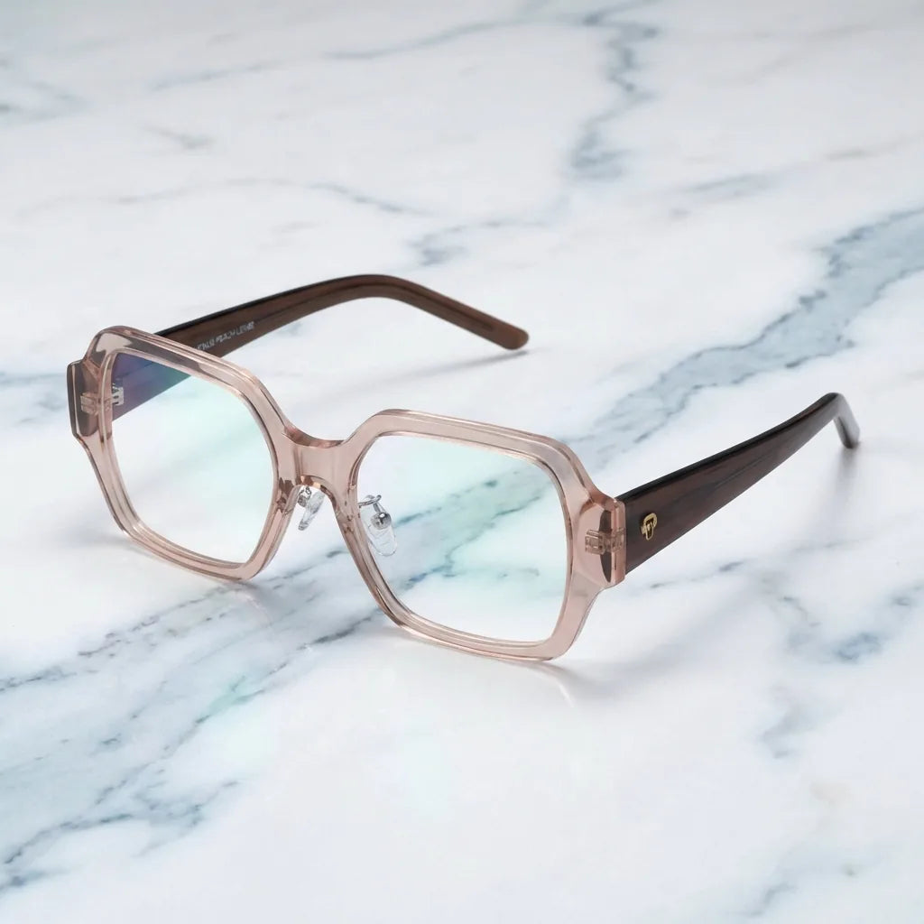 Lentes ópticos Venus Champagne sobre mármol blanco elegante armazón premium Bonoboss #editorial_armazon #color_champagne