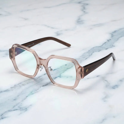 Lentes ópticos Venus Champagne sobre mármol blanco elegante armazón premium Bonoboss #editorial_armazon #color_champagne