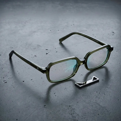 Lentes opticos Navarino Verde sobre concreto urbano minimalista antirreflex receta optica bio-acetato Bonoboss #editorial_concreto-urbano #color_verde